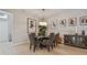 Bright dining room featuring a glass table and six chairs at 4952 Surfside Cir, Bradenton, FL 34211
