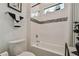 Simple bathroom with a toilet, bathtub, and shower at 4952 Surfside Cir, Bradenton, FL 34211