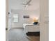 Cozy bedroom with a queen-size bed, ceiling fan and window at 4952 Surfside Cir, Bradenton, FL 34211