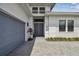 Gray double front doors with gray garage door at 4952 Surfside Cir, Bradenton, FL 34211