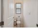 Clean and simple bathroom with a toilet and window at 4952 Surfside Cir, Bradenton, FL 34211