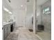 Elegant bathroom with double vanity, large shower, and marble flooring at 4952 Surfside Cir, Bradenton, FL 34211