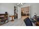 Home office with built-in shelving and view into dining room at 4952 Surfside Cir, Bradenton, FL 34211