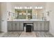 Modern bathroom with a double vanity and large mirror at 4952 Surfside Cir, Bradenton, FL 34211