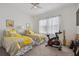 Bedroom with two twin beds, exercise bike, and TV at 4952 Surfside Cir, Bradenton, FL 34211