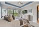 Spacious main bedroom with views of the backyard, a dresser, and a ceiling fan at 4952 Surfside Cir, Bradenton, FL 34211