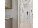 Clean and bright hallway with light colored floors at 4952 Surfside Cir, Bradenton, FL 34211