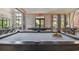 Elegant clubhouse billiards room with a large pool table at 4952 Surfside Cir, Bradenton, FL 34211
