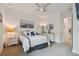 Bright bedroom with a queen-size bed and ensuite bathroom at 4952 Surfside Cir, Bradenton, FL 34211