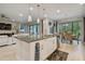 Open kitchen with island seating and stainless steel appliances at 4952 Surfside Cir, Bradenton, FL 34211