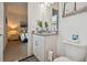 Bathroom with a toilet, vanity, and view of bedroom at 4952 Surfside Cir, Bradenton, FL 34211