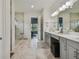 Spacious bathroom with double vanity, large shower, and marble floors at 4952 Surfside Cir, Bradenton, FL 34211