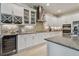 Spacious kitchen with white cabinets, granite countertops, and stainless steel appliances at 4952 Surfside Cir, Bradenton, FL 34211