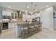 Modern kitchen with white cabinets, granite island and wine rack at 4952 Surfside Cir, Bradenton, FL 34211