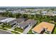 Aerial view of a luxury community with houses and a lake at 4952 Surfside Cir, Bradenton, FL 34211