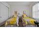 Bedroom with two twin beds, exercise bike, and TV at 4952 Surfside Cir, Bradenton, FL 34211