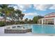 Refreshing resort-style pool with a spa and plenty of lounge chairs at 1050 Villagio Cir # 206, Sarasota, FL 34237