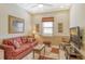 Relaxing den featuring comfortable seating and a large TV at 1130 Cielo Ct, North Venice, FL 34275