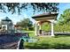 Community playground with shaded seating area at 1130 Cielo Ct, North Venice, FL 34275