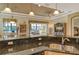 Kitchen with breakfast bar, stainless steel appliances, and granite counters at 1130 Cielo Ct, North Venice, FL 34275