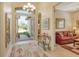Bright entryway with high ceilings, decorative rug, and access to living room at 1130 Cielo Ct, North Venice, FL 34275