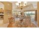 Elegant dining room situated between kitchen and living room at 1130 Cielo Ct, North Venice, FL 34275