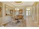 Bright dining room with a wooden table and four chairs at 1130 Cielo Ct, North Venice, FL 34275