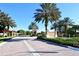 Gated community entrance with landscaping and brick driveway at 1130 Cielo Ct, North Venice, FL 34275