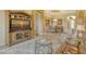 Spacious living room features a large TV, comfortable seating, and a view into the dining area at 1130 Cielo Ct, North Venice, FL 34275
