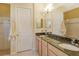 Double vanity bathroom with granite countertop and shower at 1130 Cielo Ct, North Venice, FL 34275