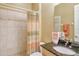 Bathroom with shower, single vanity, and granite top at 1130 Cielo Ct, North Venice, FL 34275