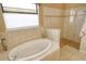 Bathroom with garden tub and walk-in shower at 1130 Cielo Ct, North Venice, FL 34275