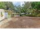 Over-sized yard with an outdoor dining area and mature trees providing ample shade at 1533 1St Ave W Dr, Bradenton, FL 34205