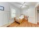Bright bedroom with hardwood floors and a vintage style, complemented by a large window at 1533 1St Ave W Dr, Bradenton, FL 34205