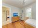 Cozy bedroom with hardwood floors, and a charming view into another room at 1533 1St Ave W Dr, Bradenton, FL 34205