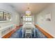 Elegant dining room features a large table, hardwood floors and soft natural lighting at 1533 1St Ave W Dr, Bradenton, FL 34205