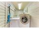Functional laundry room with white washer and dryer, and convenient utility sink at 1533 1St Ave W Dr, Bradenton, FL 34205