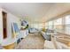Spacious living room featuring modern furnishings and a view of the dining area through a large doorway at 1533 1St Ave W Dr, Bradenton, FL 34205