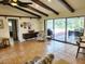 Bright living room with sliding doors leading to the pool area at 2817 Norwood Ln, Venice, FL 34292