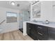 Updated bathroom with walk-in shower, modern vanity, and stylish flooring at 3125 57Th Avenue E Cir, Bradenton, FL 34203