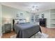 Cozy bedroom with wood floors and ceiling fan at 3125 57Th Avenue E Cir, Bradenton, FL 34203