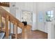 Bright entryway with wood stairs and view into an office at 3125 57Th Avenue E Cir, Bradenton, FL 34203