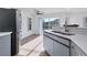 Modern kitchen features stainless steel appliances and a breakfast bar at 3125 57Th Avenue E Cir, Bradenton, FL 34203