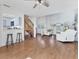 Open concept living area with hardwood floors and kitchen bar at 3125 57Th Avenue E Cir, Bradenton, FL 34203