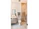 Modern bathroom featuring a glass-enclosed shower, sleek vanity, and neutral color palette at 3464 Camino Real, Sarasota, FL 34239
