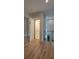 Interior view featuring an elevator, hardwood floors, and a glass railing at 3464 Camino Real, Sarasota, FL 34239