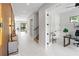 Bright hallway showcases contemporary design elements, clean lines, and access to various rooms at 3464 Camino Real, Sarasota, FL 34239