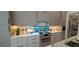 A modern kitchen with marble countertops, stainless steel appliances, and lots of cabinet space at 3464 Camino Real, Sarasota, FL 34239