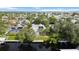 Expansive aerial view of a home with a dock on a canal with mature landscaping and solar panels at 4532 Shark Dr, Bradenton, FL 34208