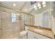 Bathroom featuring granite vanity, walk-in shower, and recessed lighting at 4532 Shark Dr, Bradenton, FL 34208